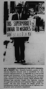 Community activist Mozel Sanders proposed a "selective buying campaign" to repsond to highway displacement inequalities. He is shown here in an April 1967 picket of stores that did not hire African Americans, part of a long tradition of "Don't Buy Where You Can't Work" campaigns.
